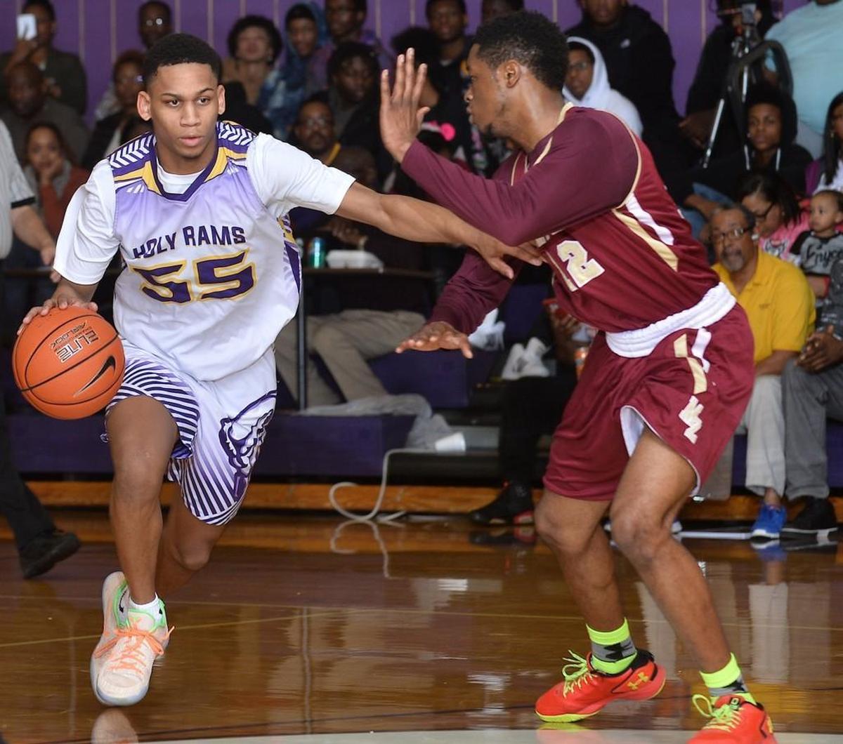 Word of God’s Blake Harris, left, drives to the lane while defended by Mount Zion’s T. Royster on Jan. 27, 2018.