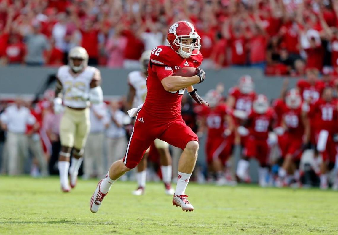 N.C. State’s Bo Hines heads for the end zone on a 54-yard touchdown reception during Wolfpack's loss to Florida State at Carter-Finley Stadium in Raleigh on September 27, 2014.