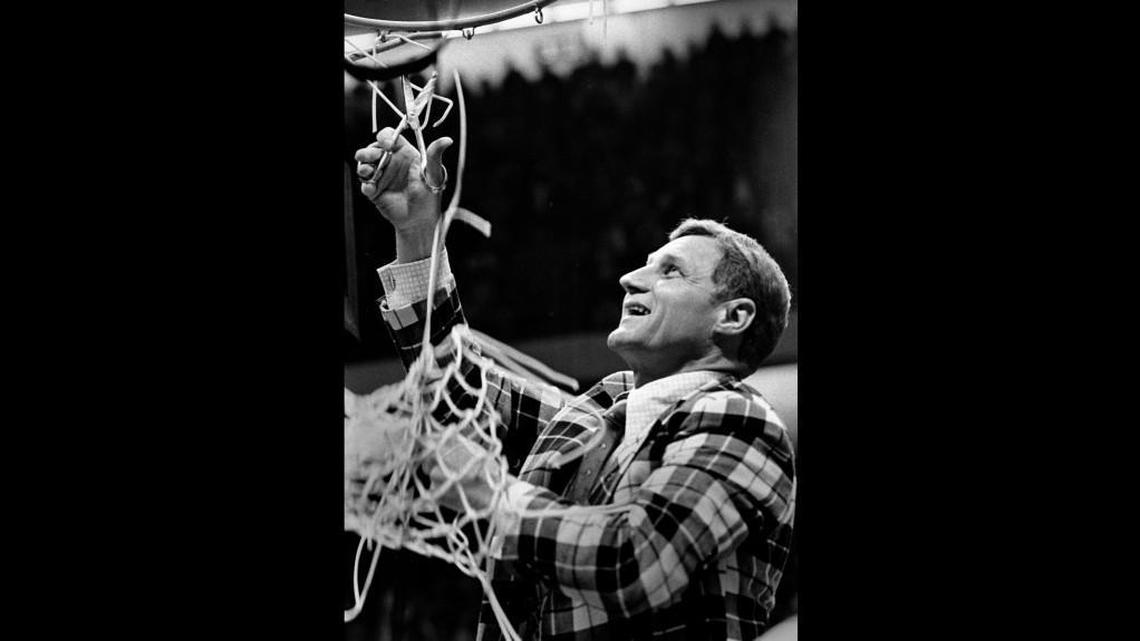 N.C. State coach Norm Sloan cuts down the nets after the Wolfpack defeated Marquette to win the 1974 national championship.