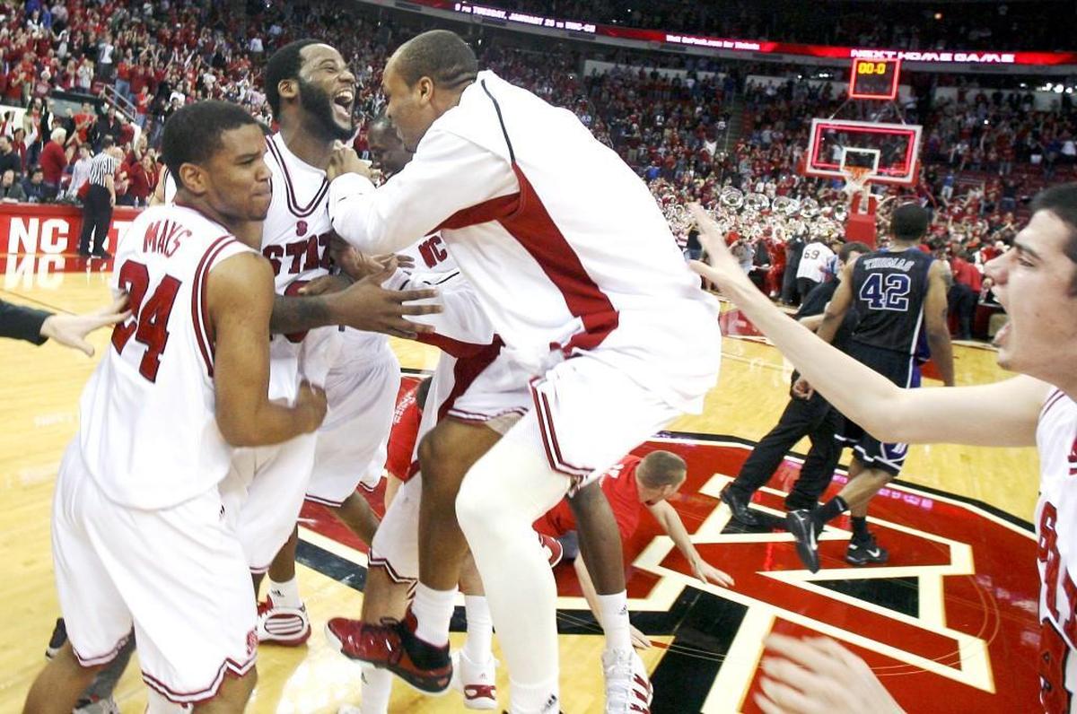 Tracy Smith, center, along with Julius Mays, Johnny Thomas and Jordan Vandenberg, right, celebrate N.C. State's 88-74 victory over Duke on Jan. 20, 2010.