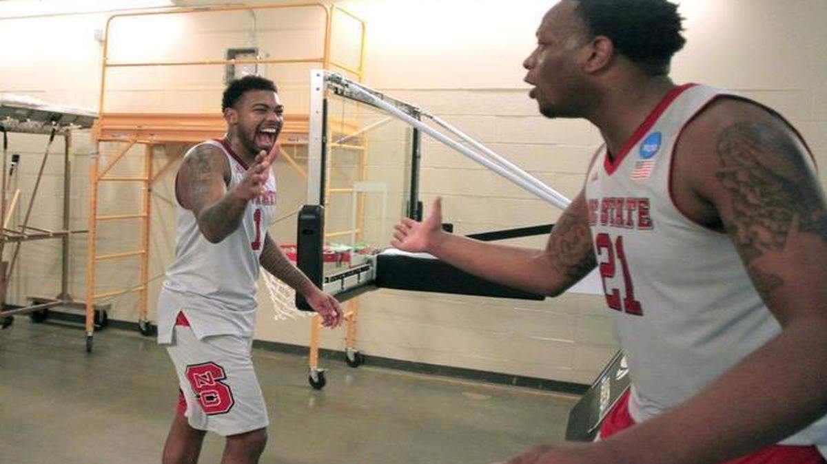 
N.C. State's Trevor Lacey, left, congratulates BeeJay Anya after the Wolfpack’s 66-65 victory over LSU in the second round of the NCAA Division I Men's Basketball Tournament at the Consol Energy Center in Pittsburgh.
