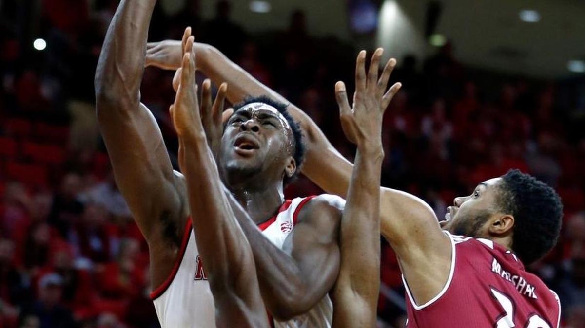 N.C. State's Abdul-Malik Abu (0) shoots while Rider's Kahlil Thomas (0), bottom and Tyere Marshall (20) guard him during the first half of the Wolfpack's game against Rider at PNC Arena in Raleigh, N.C., Wednesday, Dec. 28, 2016.