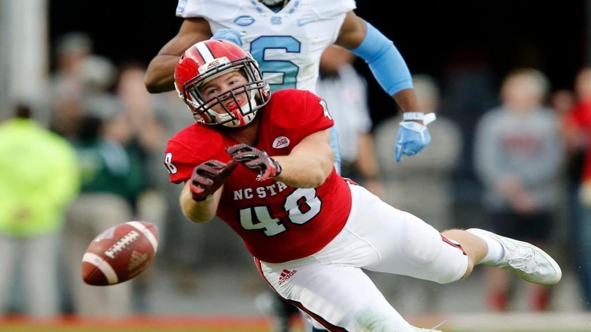 N.C. State's Cole Cook (48) can't pull in a pass as North Carolina's M.J. Stewart (6) trails during the first half at Carter-Finley Stadium in Raleigh.