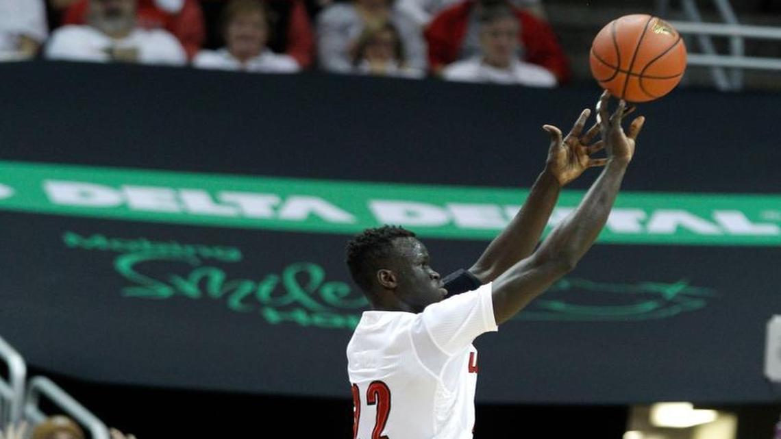 Louisville's Deng Adel (22) shoots a wide open three-pointer during N.C. State's game against Louisville at the KFC Yum! Center in Louisville, Ky. Sunday, Jan. 29, 2017.