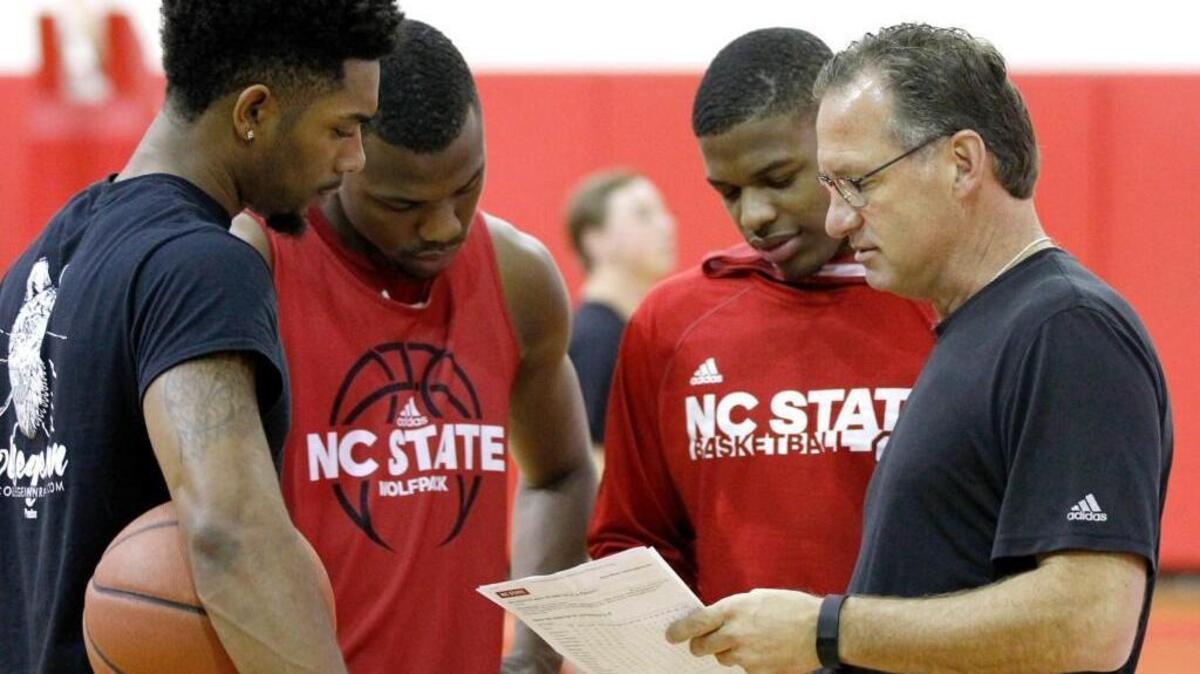 N.C. State head coach Mark Gottfried talks with Terry Henderson, left, Torin Dorn and Dennis Smith, Jr. during the Wolfpack’s basketball practice at the Curtis & Jacqueline Dail Basketball Complex in Raleigh Tuesday, Oct. 11, 2016.