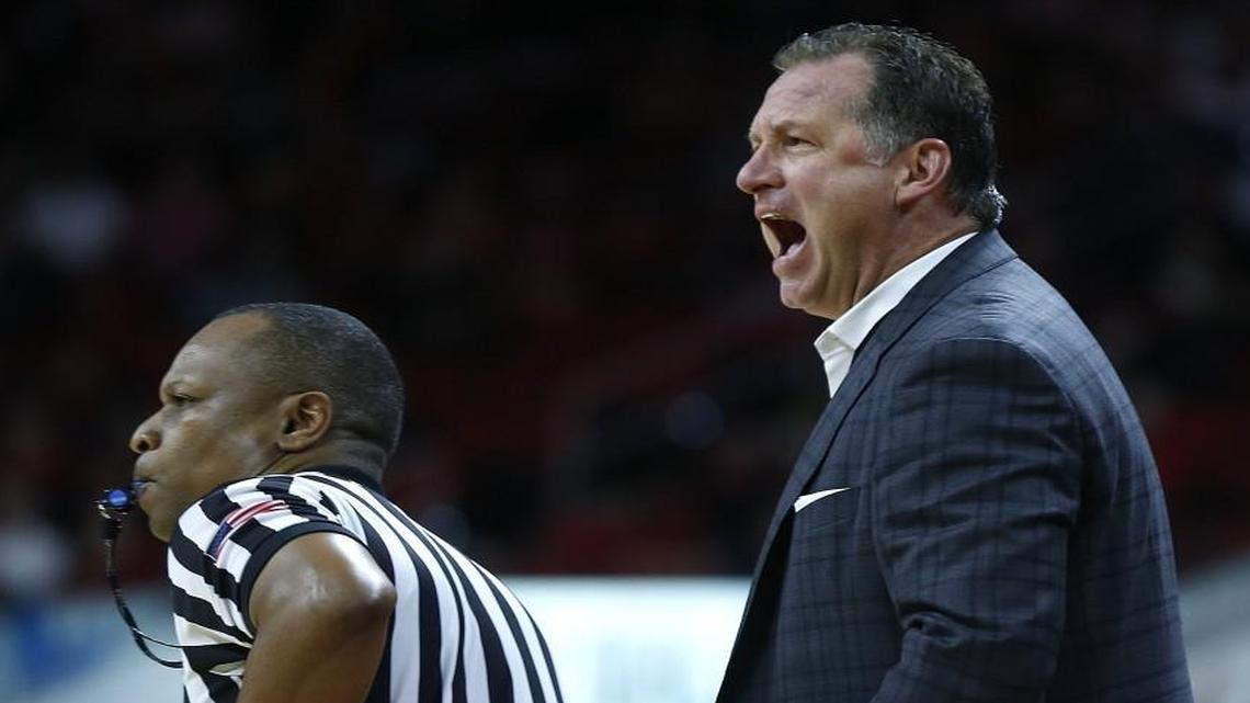 N.C. State coach Mark Gottfried yells to his team during the second half of the Wolfpack’s 77-72 loss to Louisville at PNC Arena in Raleigh.