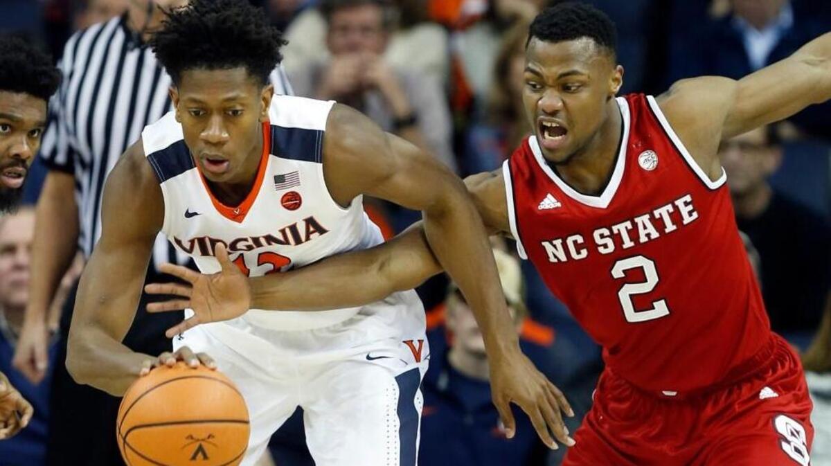 N.C. State’s Torin Dorn, right, pressures Virginia’s De’Andre Hunter during the Cavaliers’ 68-51 win in Charlottesville on Jan. 14.