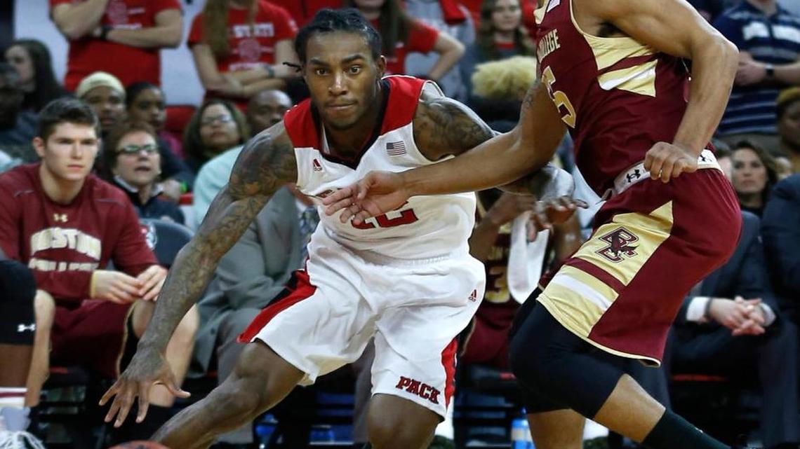 N.C. State's Cat Barber (12) drives around Boston College's Sammy Barnes-Thompkins (55) during the Wolfpack's game against Boston College at PNC Arena in Raleigh Wednesday, March 2, 2016.