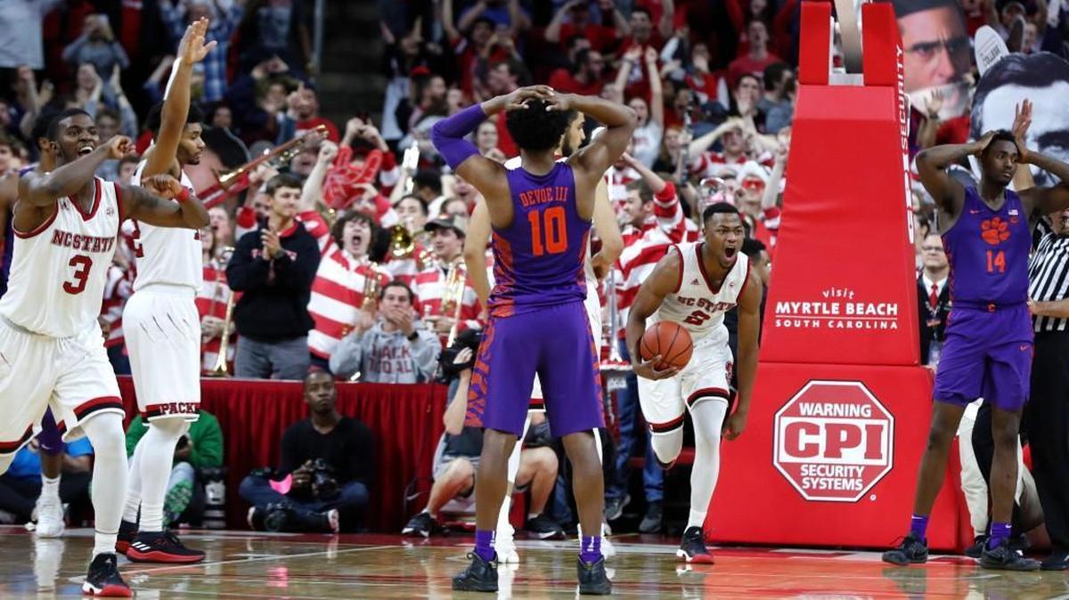N.C. State players react after Clemson’s Gabe DeVoe missed his free throw to give the Wolfpack a 78-77 win over the No. 19 Tigers on Jan. 11.