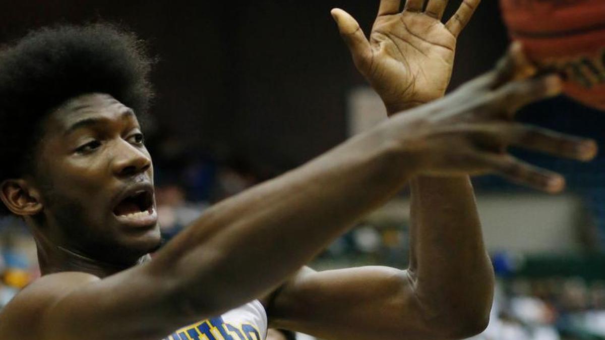 Darius Hicks, a 6-7 forward from Mississippi, picks the Wolfpack over Cincinnati.