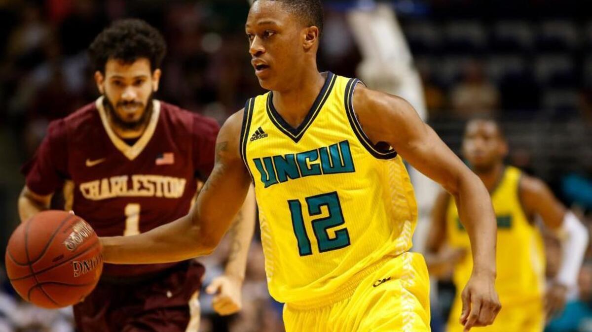 C.J. Bryce, right, decided on Saturday to transfer to N.C. State, where his former UNCW coach is now the head coach.