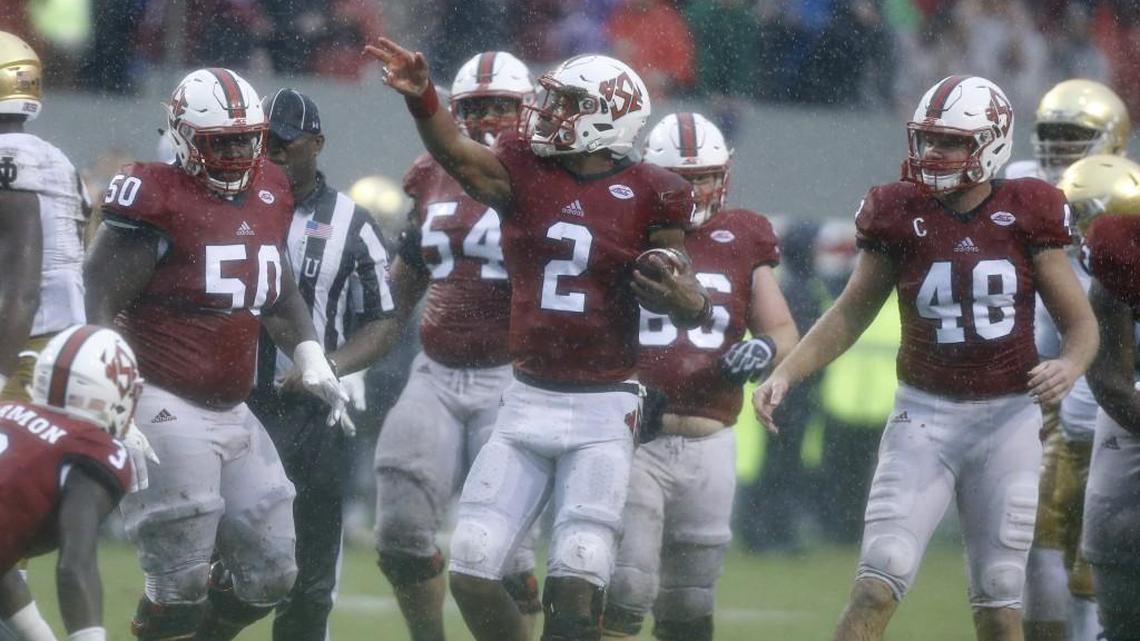 N.C. State quarterback Jalan McClendon, middle, celebrates after running for a first down in the Wolfpack’s 10-3 win over Notre Dame on Oct. 8, 2016.