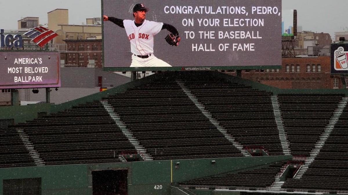 A message congratulating former Boston Red Sox pitcher Pedro Martinez on his election to baseball's Hall of Fame is displayed on a centerfield video board Jan. 6, 2015, at Fenway Park in Boston. N.C. State and Boston College are going to play a baseball game at Fenway on April 22. (AP Photo/Steven Senne)