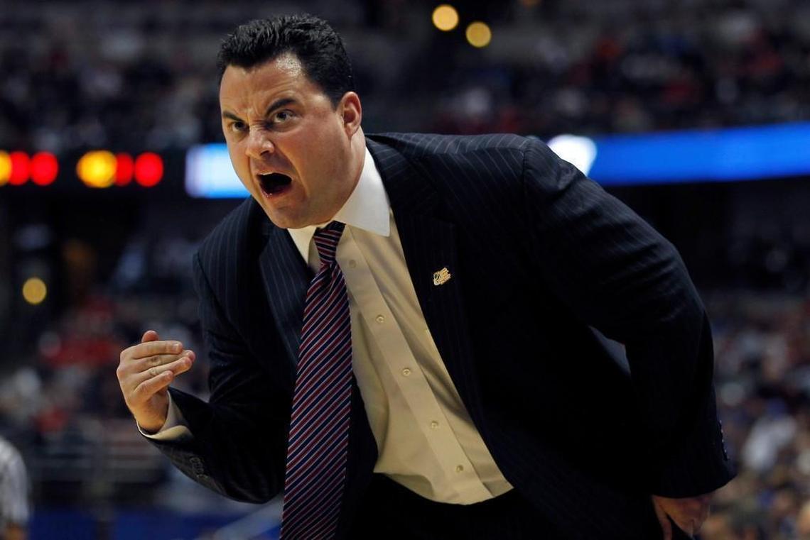 Arizona head coach Sean Miller;s name emerged in an ESPN report that claims Miller is heard on FBI wiretaps discussing payments to a player.