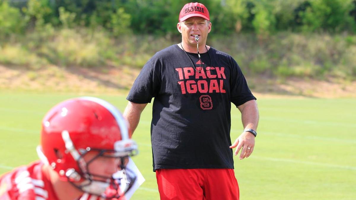 
N.C. State head football coach Dave Doeren watches during the Wolfpack's first preseason practice Tuesday, August 4, 2015, in Raleigh, N.C.
