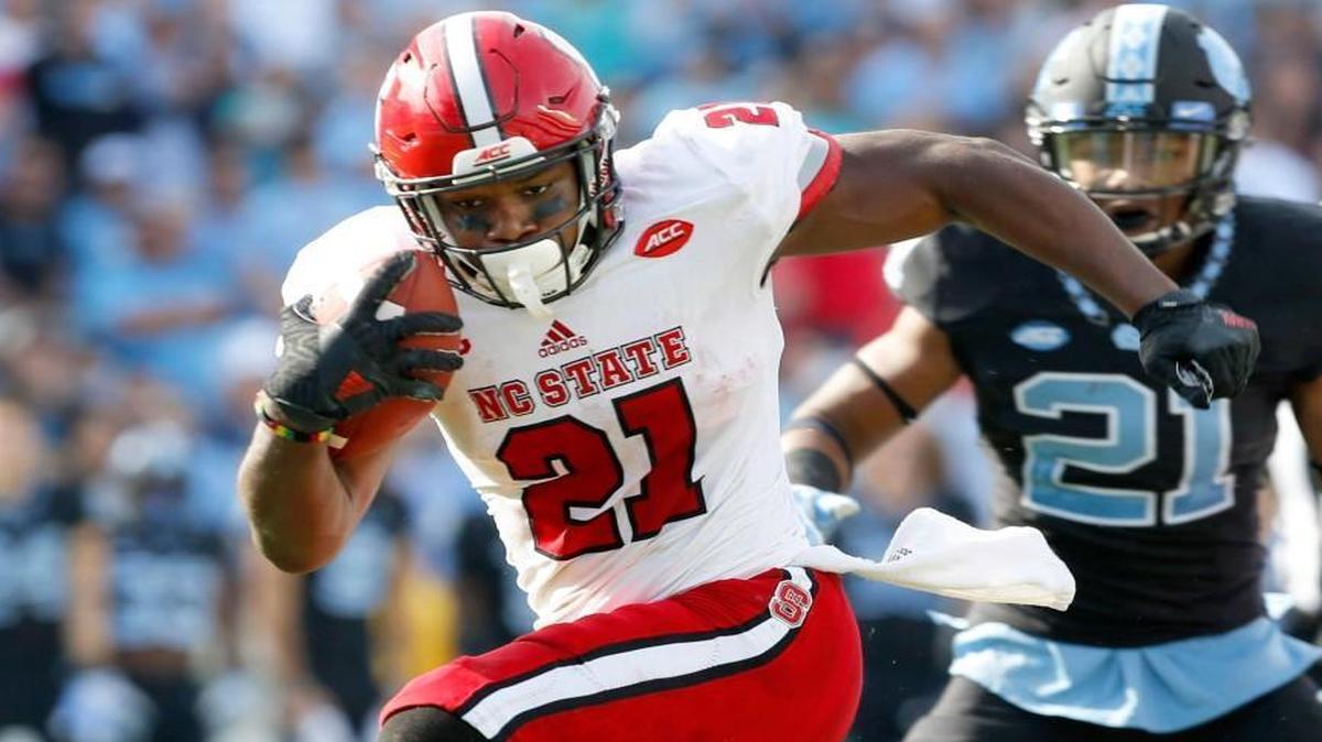 N.C. State running back Matt Dayes breaks free for an 18-yard touchdown run during the Wolfpack's 28-21 victory over UNC at Kenan Stadium in Chapel Hill Friday, Nov. 25, 2016.