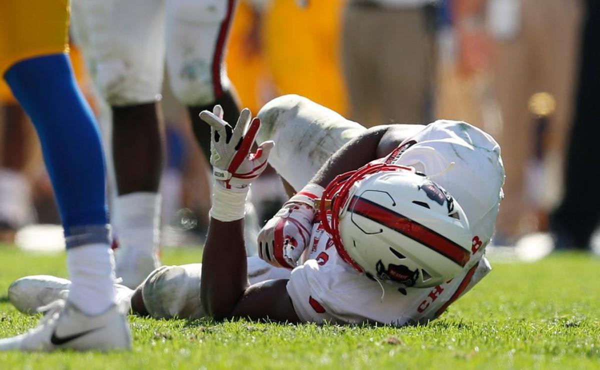 N.C. State defensive end Bradley Chubb (9) lies on the ground after he dislocated his finger during the Wolfpack’s 35-17 victory over Pitt at Heinz Field Saturday, Oct .14, 2017.