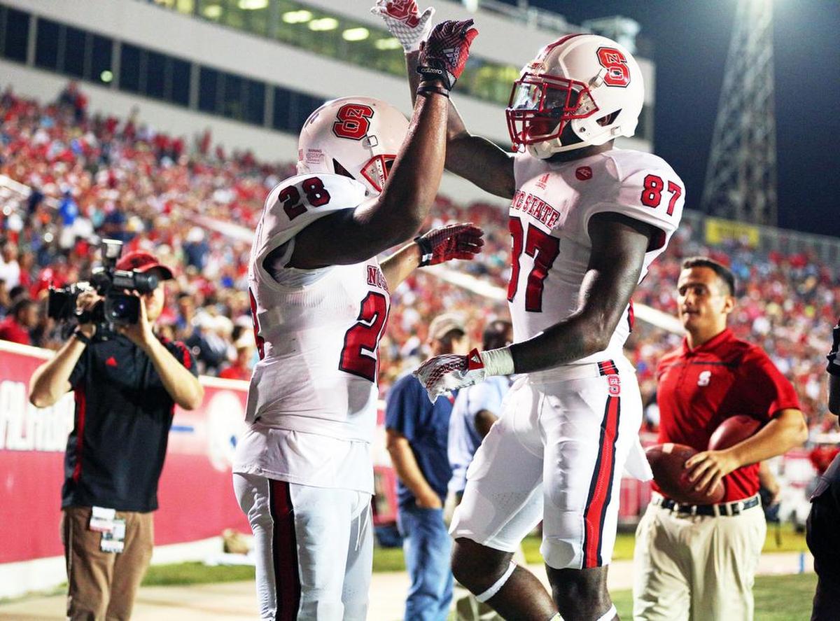 North Carolina State wide receiver Maurice Trowell (87) congratulates tight end Jaylen Samuels (28) after his touchdown against South Alabama during the first half of an NCAA college football game Saturday, Sept. 26, 2015, at Ladd-Peebles Stadium in Mobile, Ala.