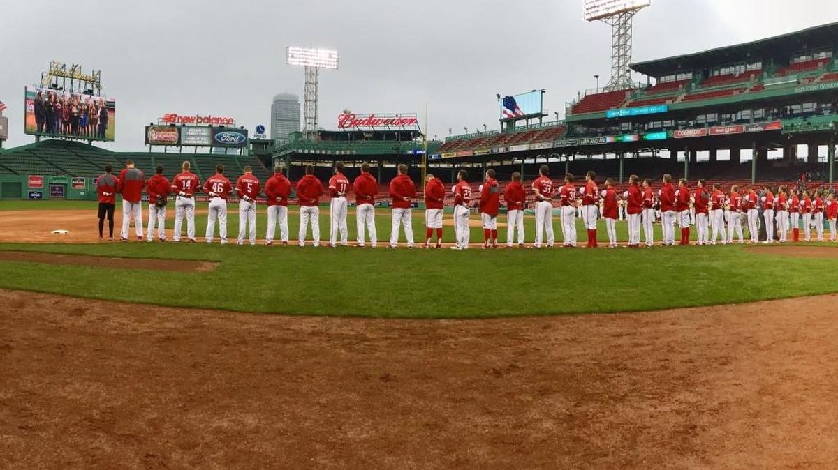 The N.C. State baseball team stands for the National Anthem before a game with Boston College played at Fenway Park in Boston on April 22, 2017