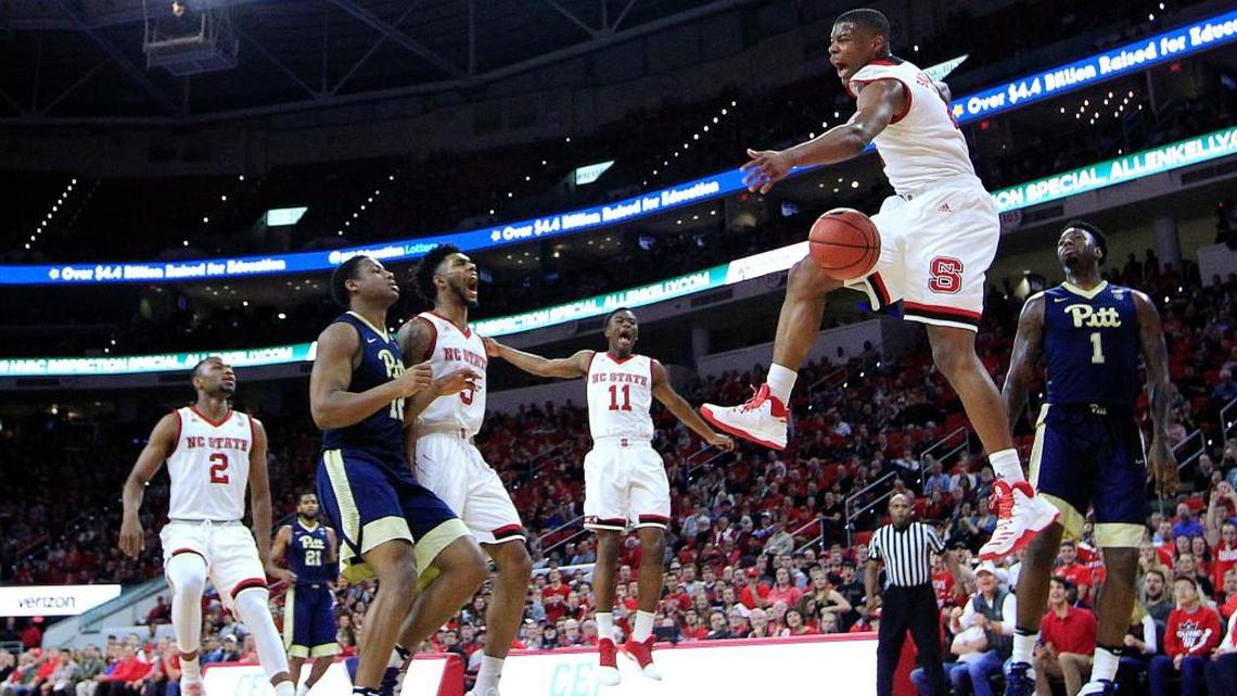 N.C. State's Dennis Smith Jr. (4) celebrates after slamming in two in the first half during N.C. State's 79-74 victory over Pitt at PNC Arena on Tuesday, Jan. 17, 2017.
