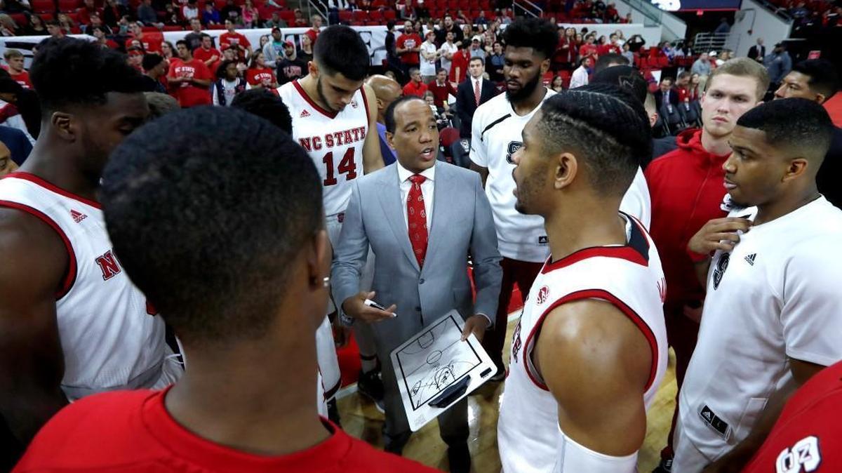 N.C. State coach Kevin Keatts huddles with his team before the Wolfpack’s game against Jacksonville on Dec. 22.