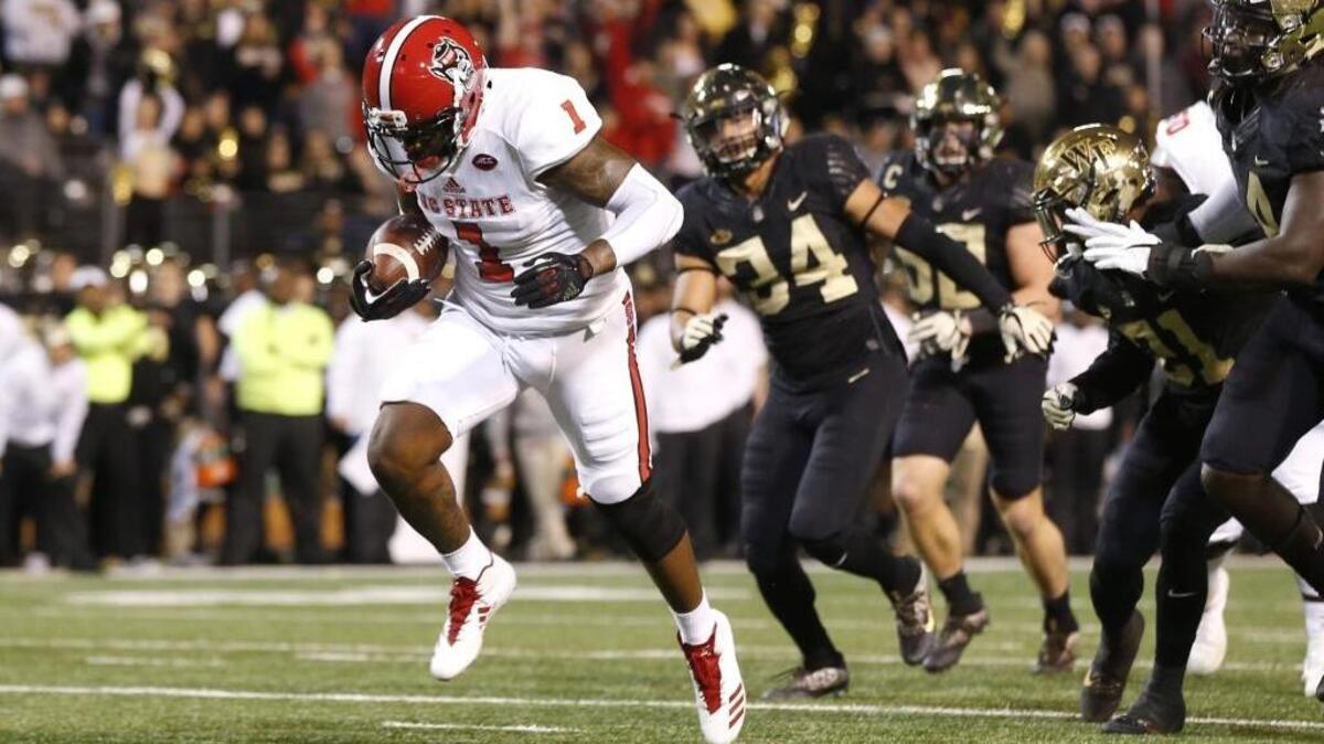 N.C. State's Jaylen Samuels (1) scores on an 11-yard touchdown run during the first half of N.C. State's game against Wake Forest at BB&T Field in Winston-Salem, N.C., Saturday, Nov. 18, 2017.