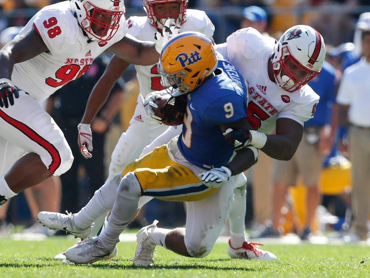 N.C. State's Darian Roseboro (45) tackles Pitt's Michael Smith (9) during the Wolfpack’s 35-17 victory over Pitt at Heinz Field Saturday, Oct .14, 2017.