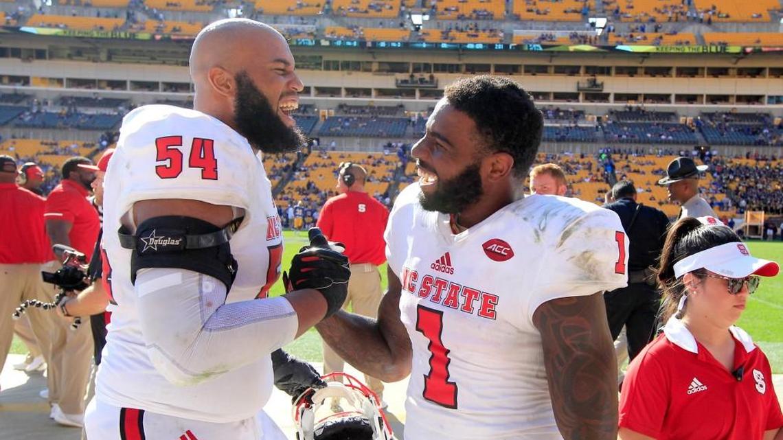 N.C. State offensive tackle Will Richardson, left, celebrates with Jaylen Samuels near the end of the Wolfpack’s 35-17 victory over Pittsburgh on Oct. 14.
