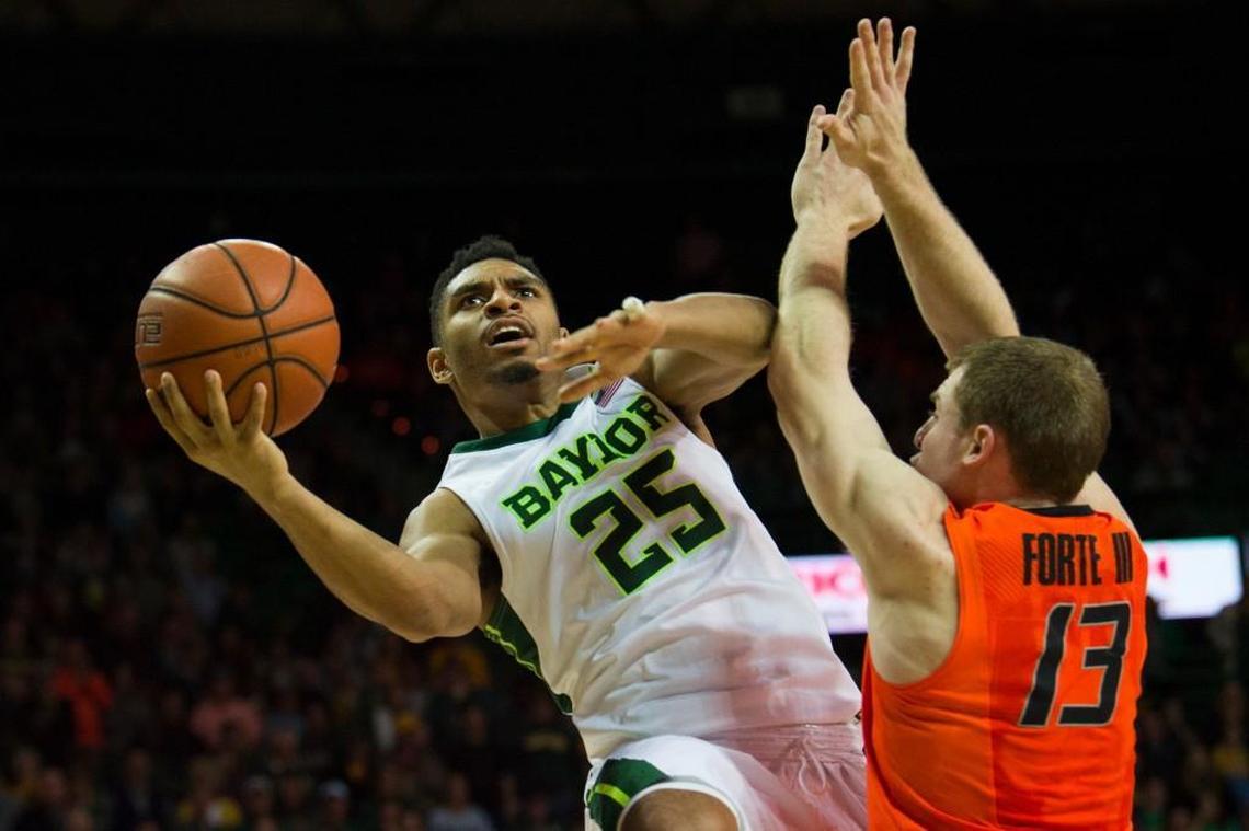 Al Freeman #25 of the Baylor Bears drives to the basket against Phil Forte III #13 of the Oklahoma State Cowboys on January 7, 2017 at the Ferrell Center in Waco, Texas.