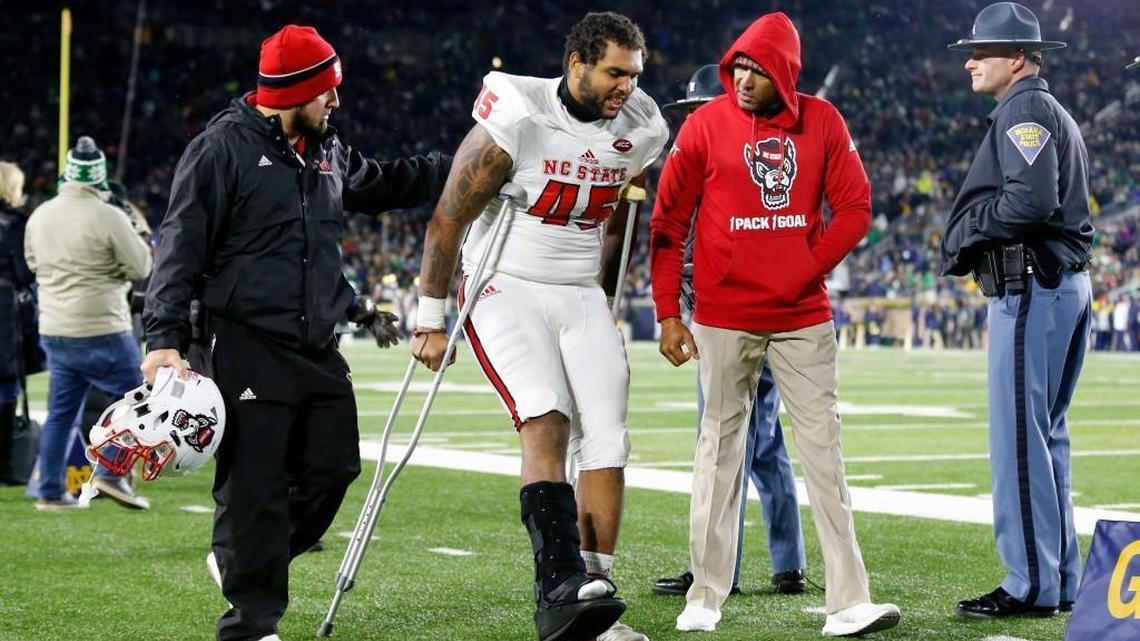 N.C. State’s Darian Roseboro (45) is helped as he leaves the field in the second half of Notre Dame 35-14 victory in South Bend, Ind., Saturday, Oct. 28, 2017.