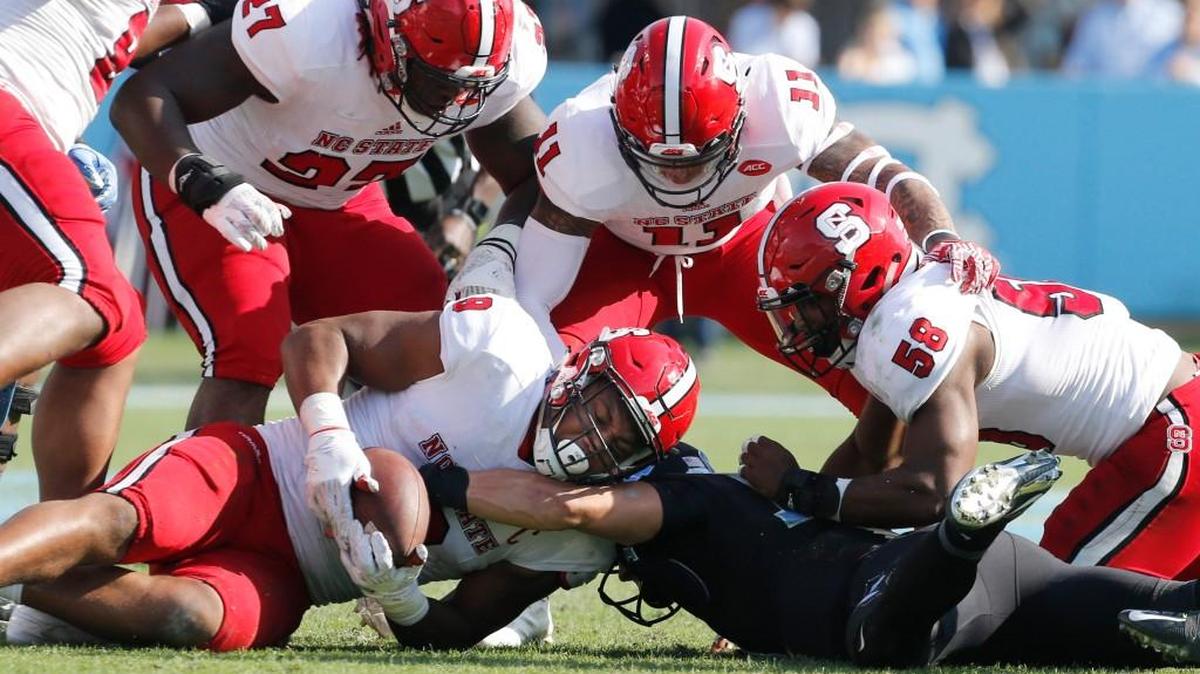 N.C. State defensive end Bradley Chubb (9) recovers a fumble by North Carolina quarterback Mitch Trubisky (10) at Kenan Stadium on Nov. 25.