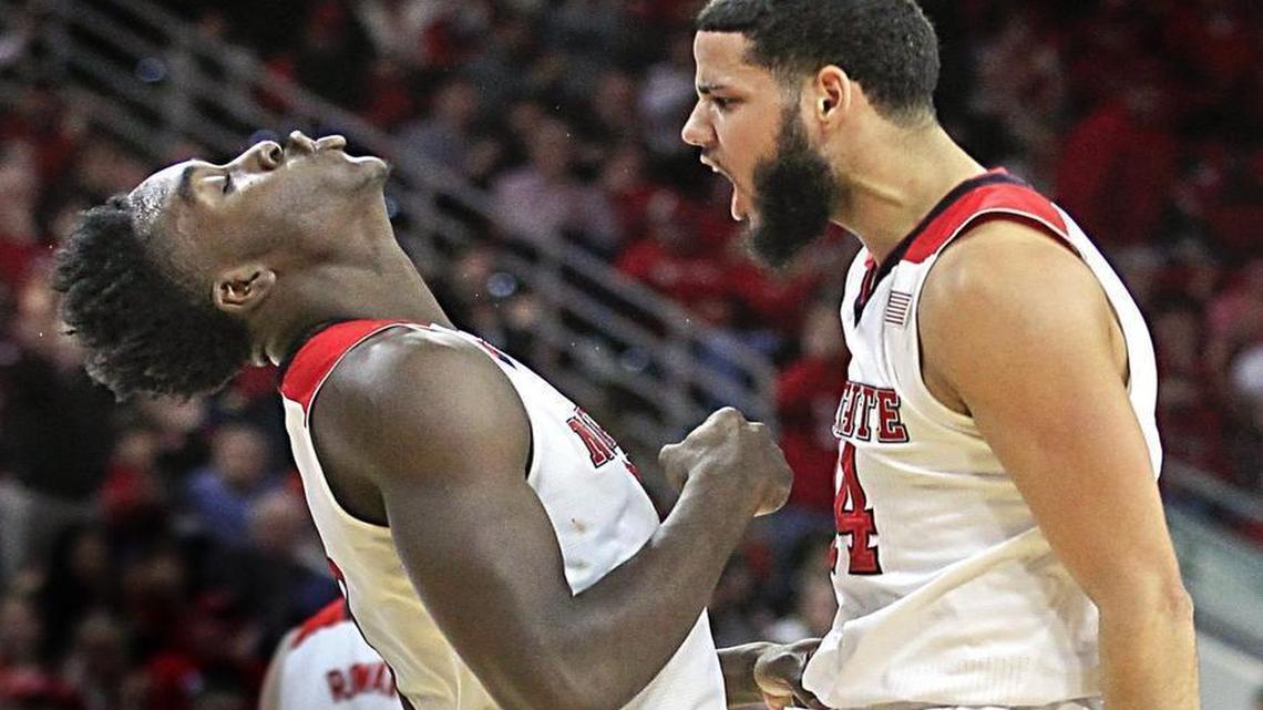 N.C. State's Caleb Martin, right, and Abdul-Malik Abu celebrate after Abu was fouled while making the basket during the Wolfpack's 99-88 victory over Wake Forest at PNC Arena in Raleigh.