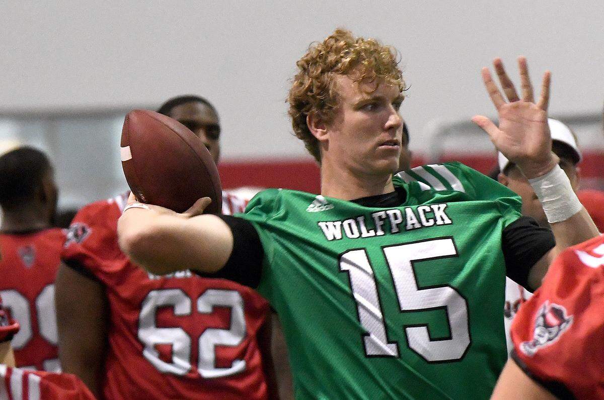 NC State quarterback Ryan Finley (15) works out during the first day of practice at the Wolfpack’s indoor practice facility in Raleigh, N.C. Friday, August 3, 2018.