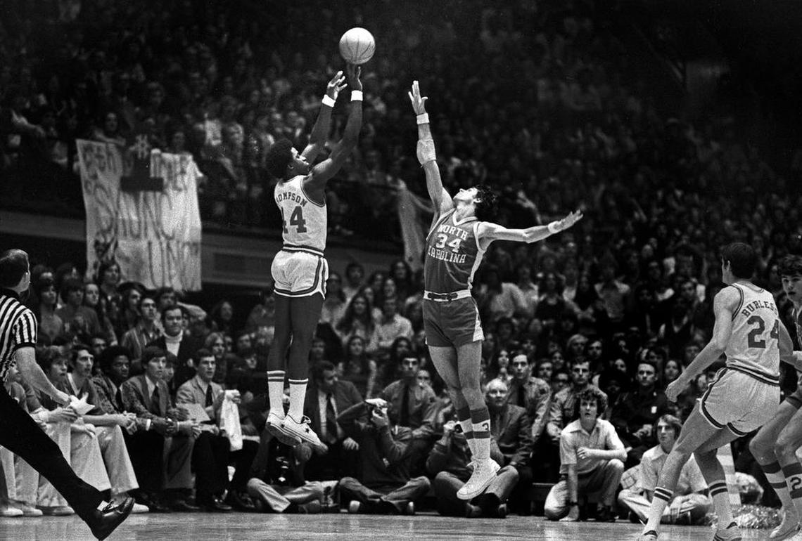 NC State’s David Thompson shoots over UNC’s Bobby Jones in Reynolds Coliseum in Raleigh in 1974. The two men would later become teammates in the ABA.