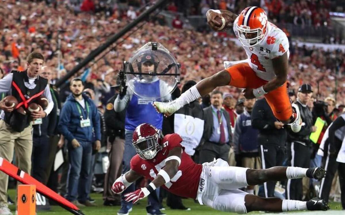 Clemson quarterback Deshaun Watson is stopped short of the goal line by Alabama defensive back Ronnie Harrison during the fourth quarter of the 2017 national championship on Jan. 9. The Tigers won 35-31.