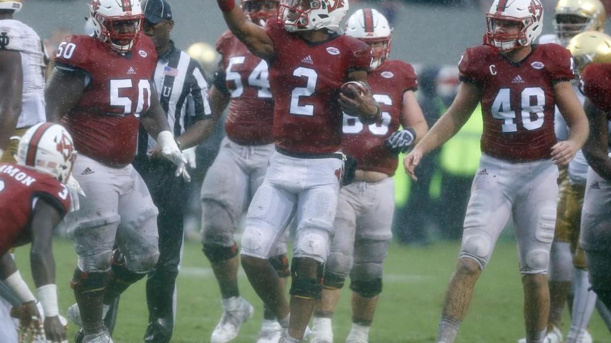 N.C. State quarterback Jalan McClendon, middle, celebrates after running for a first down during the second half of the Wolfpack’s 10-3 victory over Notre Dame on Oct. 8.