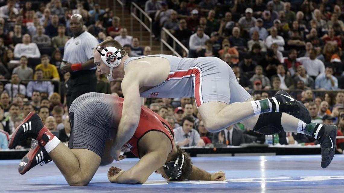 Ohio State’s Kyle Snyder, right, attempts a takedown on N.C. State’s Nick Gwiazdowski during the 285-pound championship match of the NCAA Division I wrestling championships on Saturday. Snyder won in overtime.