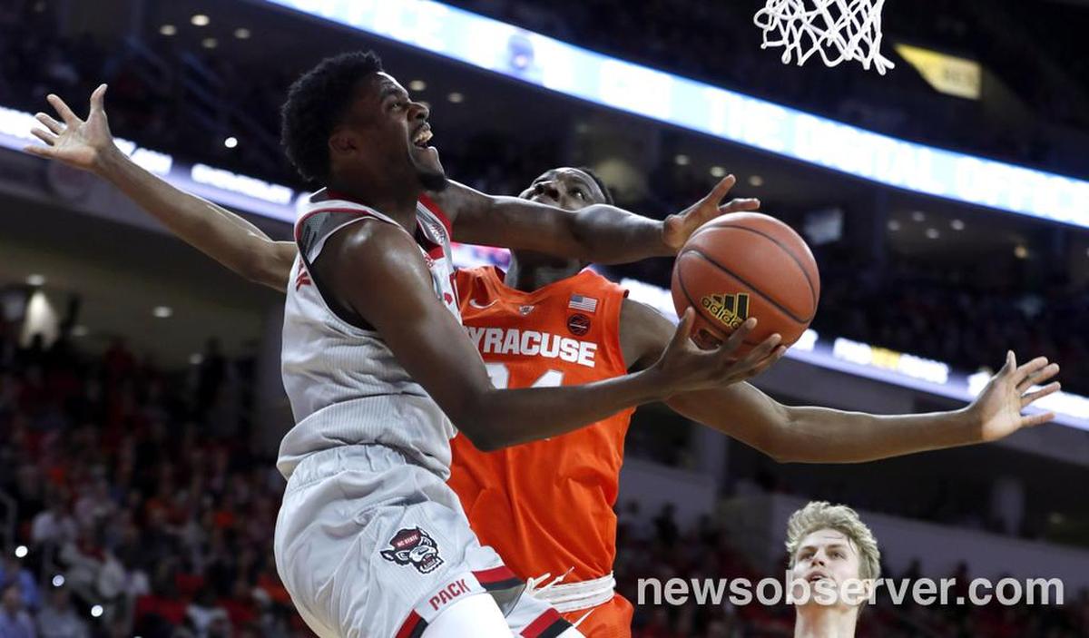 N.C. State’s DJ Funderburk (0) is fouled by Syracuse’s Bourama Sidibe (34) during the second half of N.C. State’s 73-58 victory over Syracuse at PNC Arena in Raleigh, N.C., Wednesday, Feb. 13, 2019.