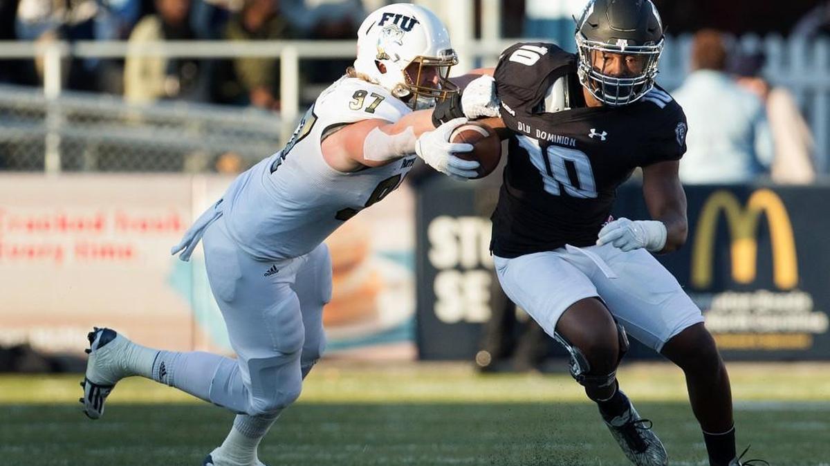 Old Dominion's David Washington of Raleigh runs away from Florida International's Newton Salisbury on Nov. 26, 2016, in Norfolk, Va. (L. Todd Spencer/The Virginian-Pilot via AP)