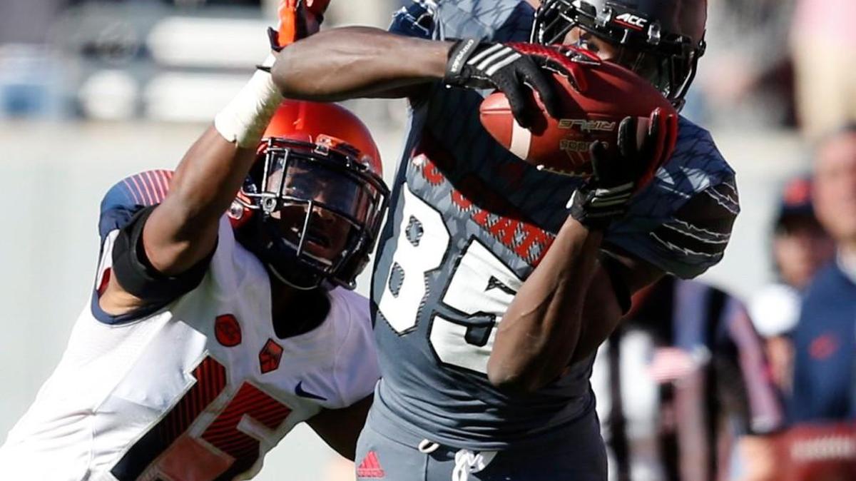 N.C. State wide receiver Jumichael Ramos (85) makes a 34-yard reception as Syracuse's Juwan Dowels (15) defends during the second half of Wolfpack’s 42-29 victory over Syracuse at Carter-Finley Stadium on Nov. 21, 2015.
