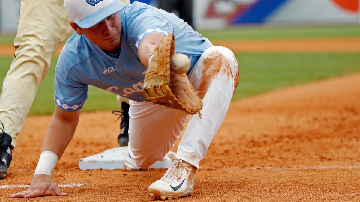 North Carolina infielder Michael Busch makes a backhanded catch as he tries to get a Florida State runner out at first during in the ACC baseball tournament title game on Sunday. UNC will host Davidson on Friday at 6 p.m. in the NCAA tournament.