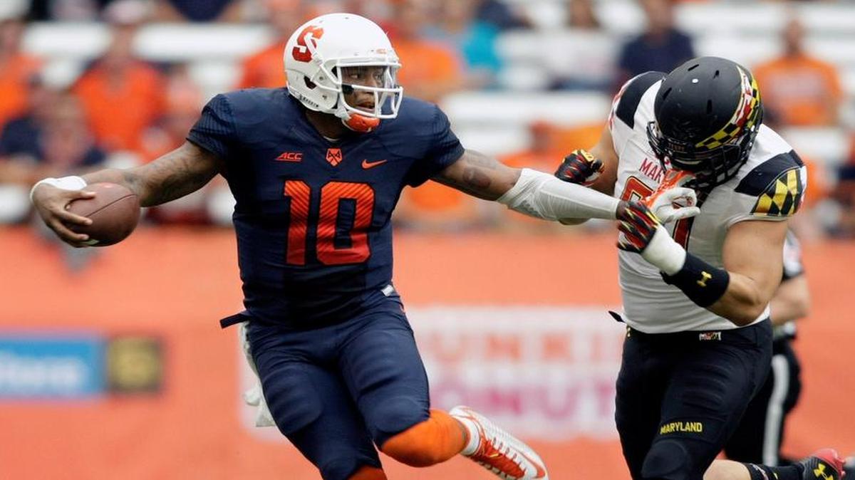 
Syracuse’s Terrel Hunt, left, grabs the face mask of Maryland’s Roman Braglio during their game at the Carrier Dome in Syracuse, N.Y., Saturday, Sept. 20, 2014. Maryland won 34-20. 
