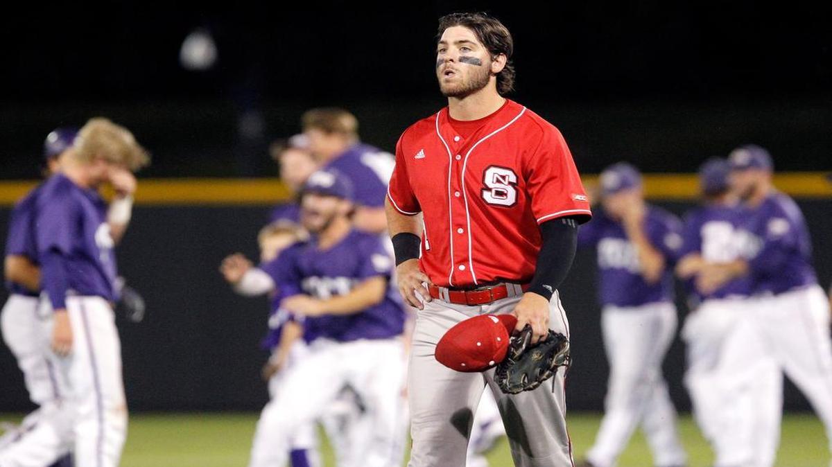 
N.C. State’s Bubby Riley walks back to the dugout after his team lost to TCU in the tenth inning at the Fort Worth Regional of the NCAA college baseball tournament in Fort Worth,Texas, on Monday, June 1, 2015. 

