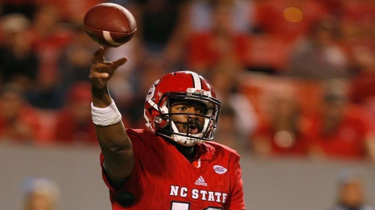 N.C. State quarterback Jacoby Brissett (12) passes during the second half of UNC's 45-34 victory over N.C. State at Carter-Finley Stadium on Nov. 28, 2015