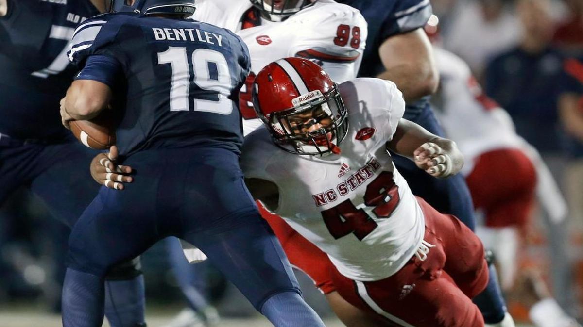N.C. State defensive end Bradley Chubb (49) pressures Old Dominion quarterback Shuler Bentley (19) during the second half of N.C. State's 38-14 victory over Old Dominion at S.B. Ballard Stadium in Norfolk, Va., Saturday Sept. 19, 2015. Bentley would be sacked by Mike Rose (90).
