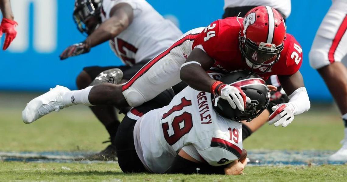 N.C. State’s Shawn Boone sacks South Carolina quarterback Jake Bentley during the Wolfpack’s game against the Gamecocks on Sept. 2.