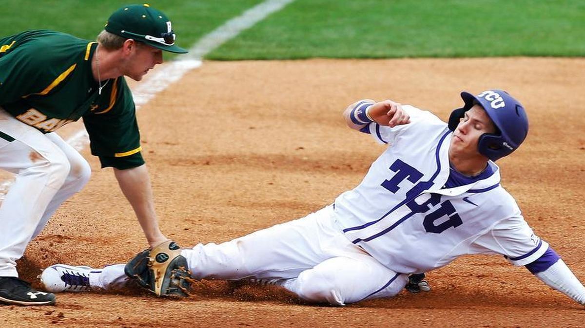 
TCU's Nolan Brown, right, is tagged out by Baylor third baseman Duncan Wendel, left, in the second inning of a first round game at the NCAA college Big 12 conference baseball tournament in Tulsa, Okla., Wednesday, May 20, 2015. Baylor won 6-5. 
