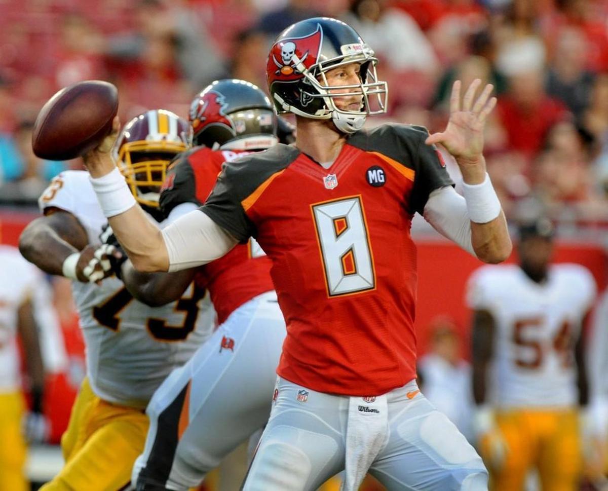 Quarterback Mike Glennon of the Tampa Bay Buccaneers throws against the Washington Redskins at Raymond James Stadium on August 28, 2014 in Tampa, Fla. The Former N.C. State quarterback, now with the Chicago Bears, will compete with former UNC quarterback Mitch Trubisky, who was chosen second overall in Thursday’s NFL Draft.