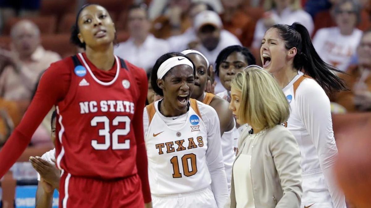 Texas guard Lashann Higgs (10) celebrates a play behind N.C. State center Akela Maize (32) during a second-round game in the NCAA women's college basketball tournament in Austin, Texas.