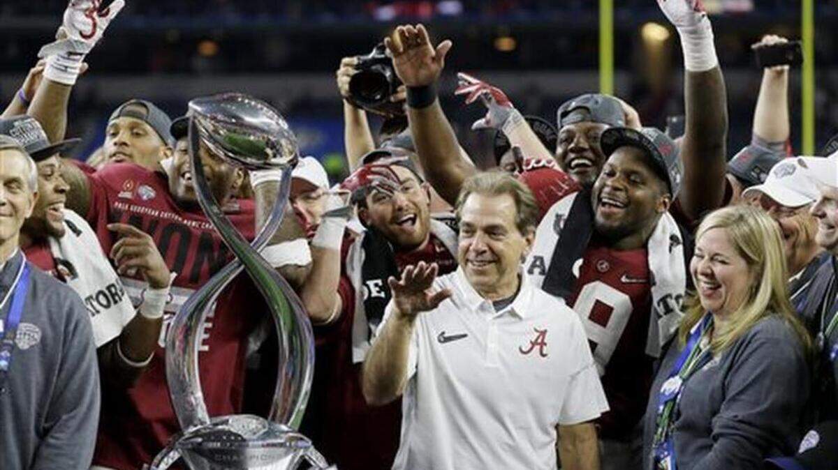 Alabama head coach Nick Saban joins the team in celebration after the Cotton Bowl NCAA college football semifinal playoff game against Michigan State, Thursday, Dec. 31, 2015, in Arlington, Texas. Alabama won 38-0 to advance to the championship game.